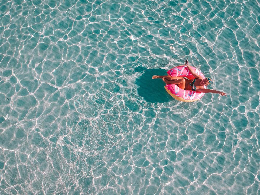 Floating around in La Pelosa Beach in Sardinia, Italy